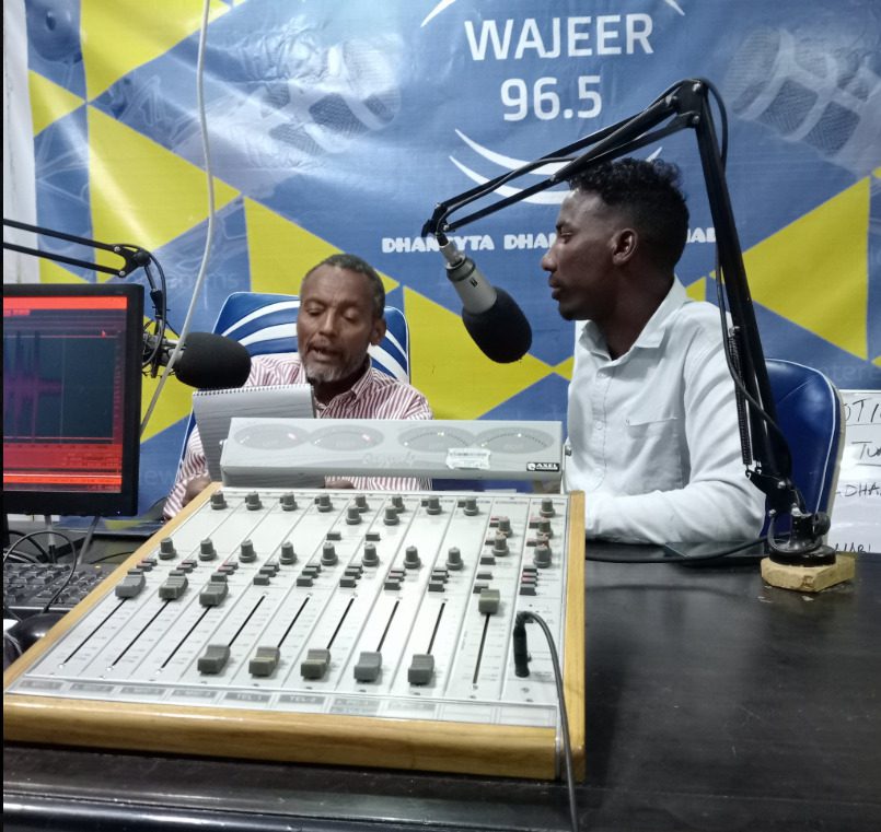 PARANET representative speaking during a live radio talk show on civil documentation awareness in Wajir.